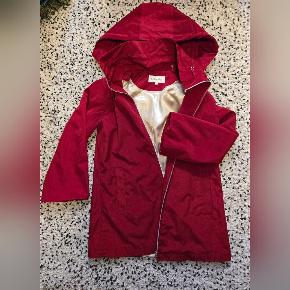 Calvin Klein 3/4 sleeve, Zip up, Hooded Red Jacket. Size XS. 2 pockets.